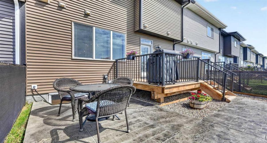 Stamped concrete patio transitions into sidewalk