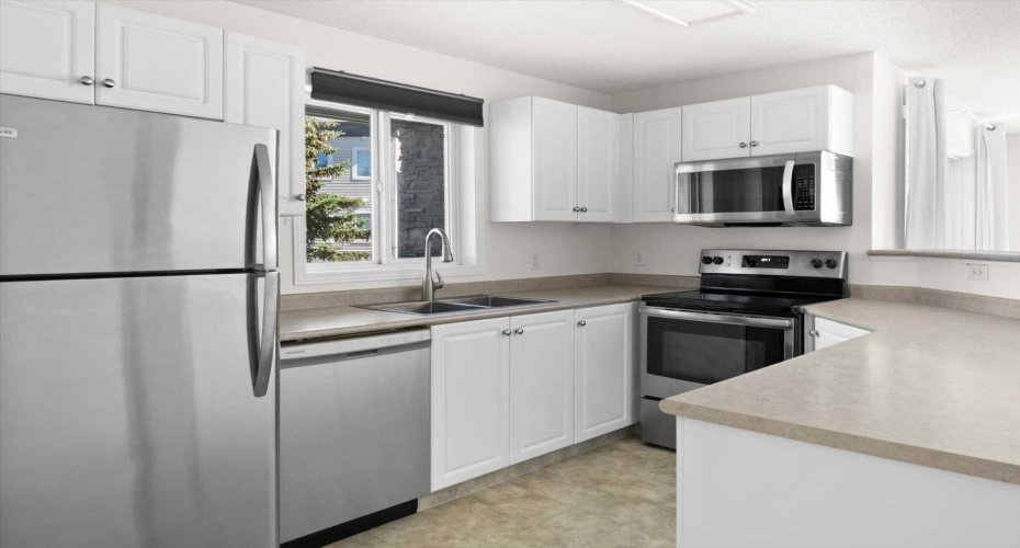 Updated kitchen with stainless steel appliances and newer kitchen sink