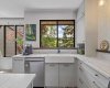 A better view of the farmhouse sink. There is a lot of counter space in this kitchen.