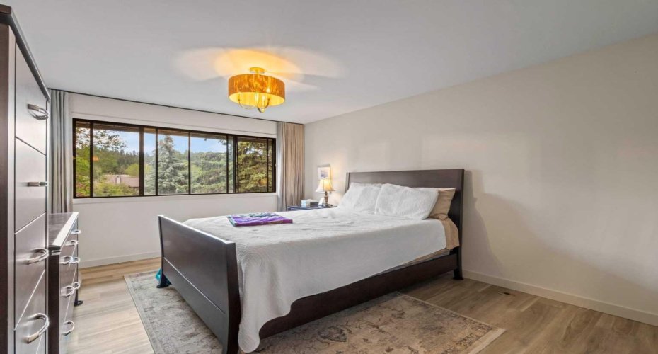 The Primary Bedroom has a lot of space and has huge windows allowing for natural light.