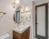 Another view of the ensuite bathroom for the Primary Bedroom. Note the door with glass inset window.
