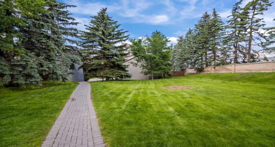 There is a large greenspace next to the unit with a walking path connecting the complex to the rest of the community.