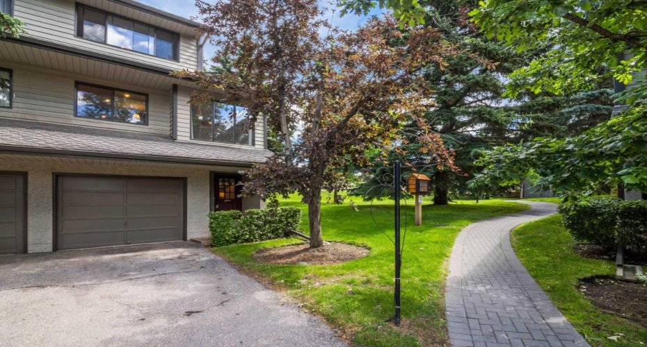 This townhome is an end unit, meaning the unit is attached to only 1 neighbor. Note the single attached garage and the driveway. There is room for two vehicles.