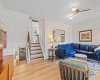 Another view of the spacious living room. The stairs going up lead to the kitchen.