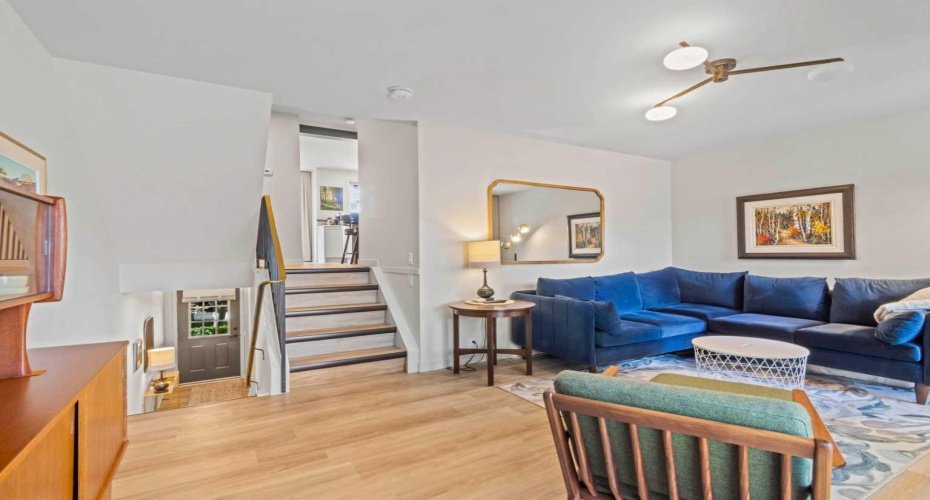 Another view of the spacious living room. The stairs going up lead to the kitchen.