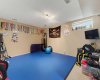 Versatile lower-level recreation room offering the perfect space for a family room, home gym or playroom.