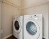 MAIN FLOOR LAUNDRY makes daily routines effortless, with additional shelving to keep laundry essentials neatly organized.