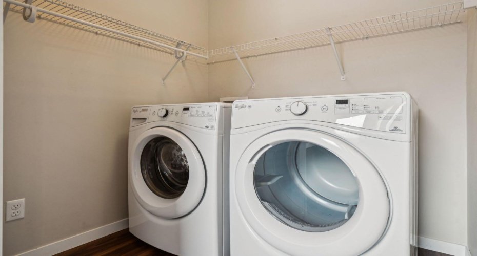 MAIN FLOOR LAUNDRY makes daily routines effortless, with additional shelving to keep laundry essentials neatly organized.