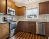 The heart of the home, this bright kitchen features GRANITE COUNTERTOPS, STAINLESS STEEL APPLIANCES, and plenty of prep space for everything from weeknight dinners to weekend entertaining.