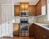 Whether you're preparing weeknight meals or hosting friends, this well-appointed kitchen offers generous prep space, timeless finishes, and a seamless layout designed for everyday living.