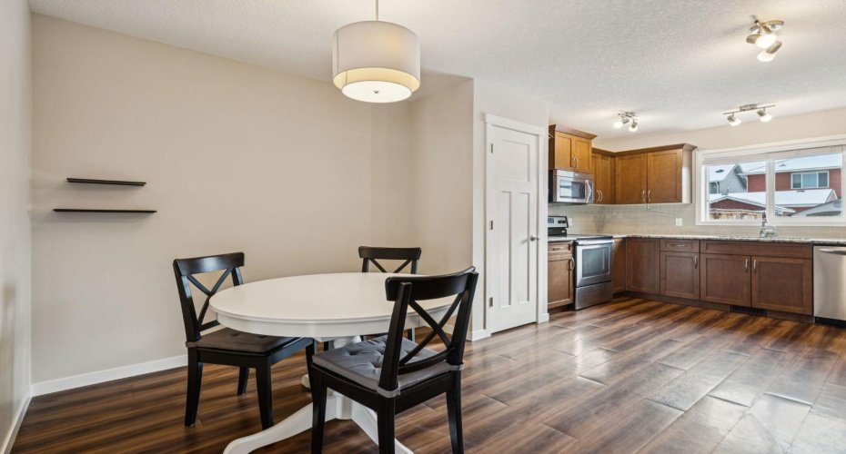 Gather around the table in the bright dining area, perfectly positioned beside the kitchen for effortless family meals, morning coffee, and entertaining.
