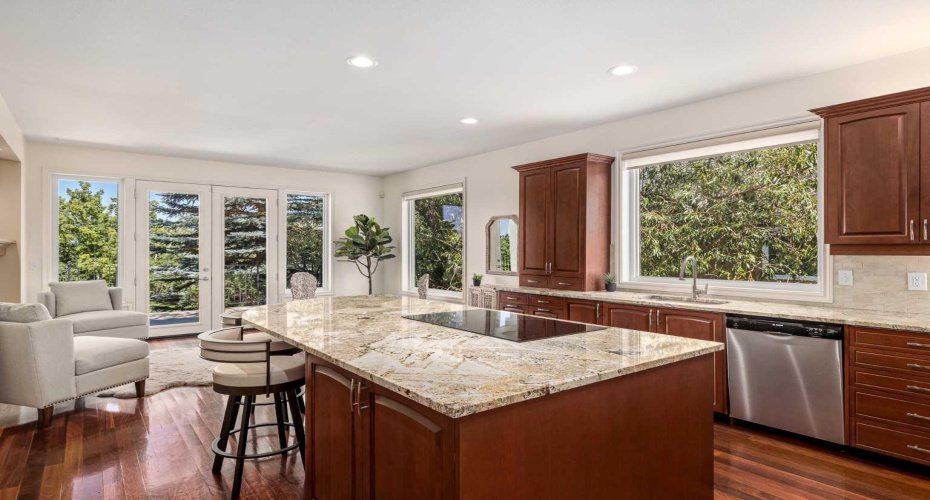 The gourmet kitchen includes custom cabinetry and a large island