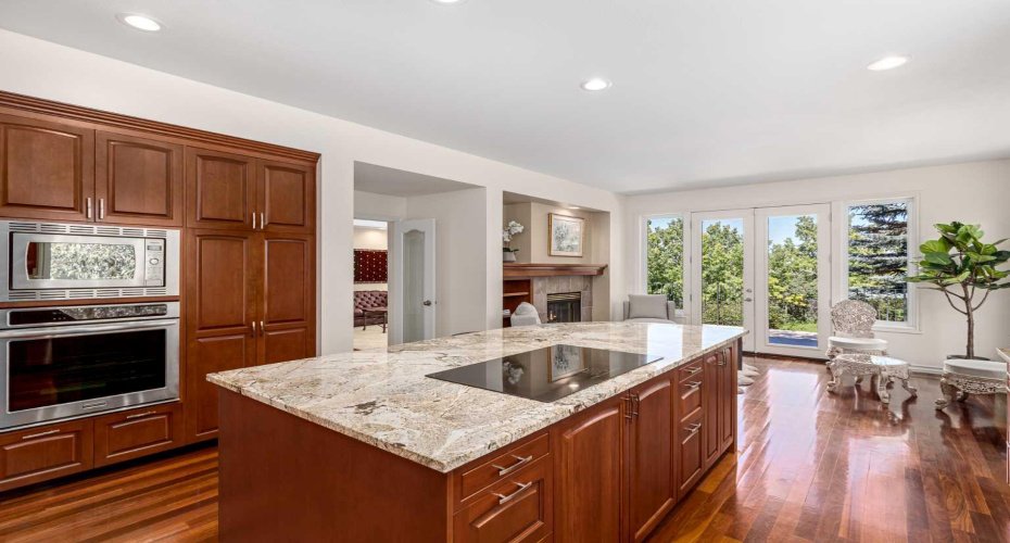A chef's dream with a 36" electric cooktop and built-in wall oven and microwave