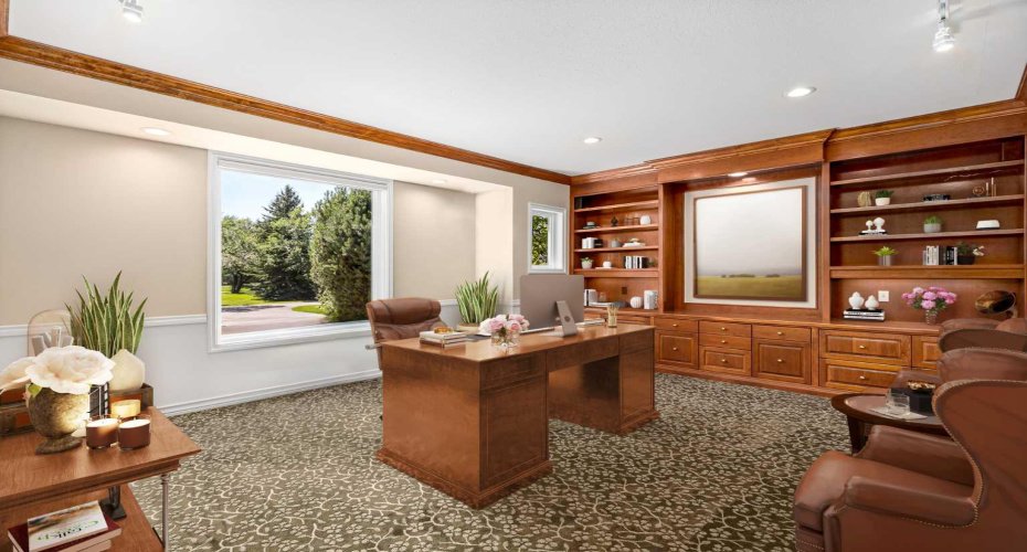 The large office/den on the main level (virtually staged)