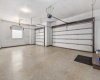 Triple car garage with heated epoxy floors