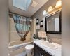 Main Floor 4 Piece Bathroom W/ Skylight.