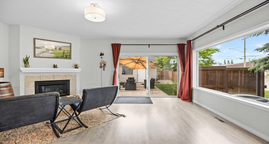 The living room flows out to a private, fully fenced backyard and sun drenched deck, ideal for summer evenings.