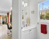 A convenient and updated main floor powder room, bright and well appointed for guests.