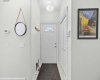 A welcoming front entry with tile flooring, ample closet storage, and a smart thermostat: the perfect first impression.