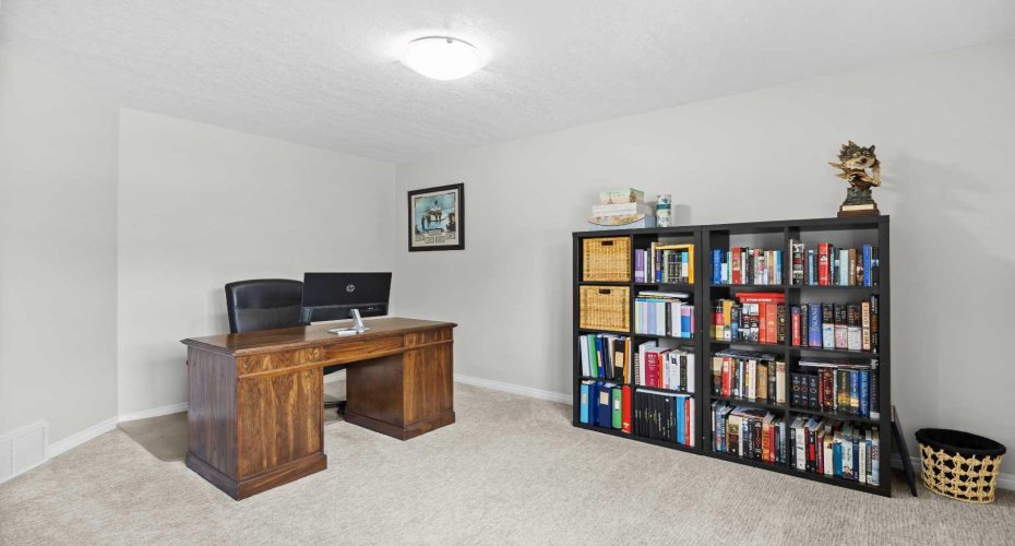 A versatile upstairs bedroom currently used as a home office.