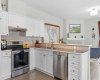 Generous counter space and a Bosch dishwasher make this kitchen as practical as it is polished, with sightlines straight through to the family room.