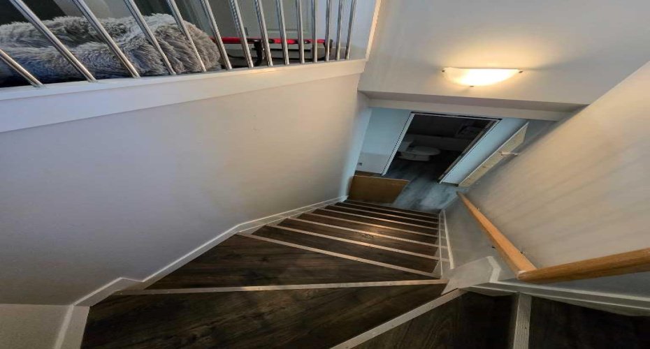 Curved Stair Way to Basement