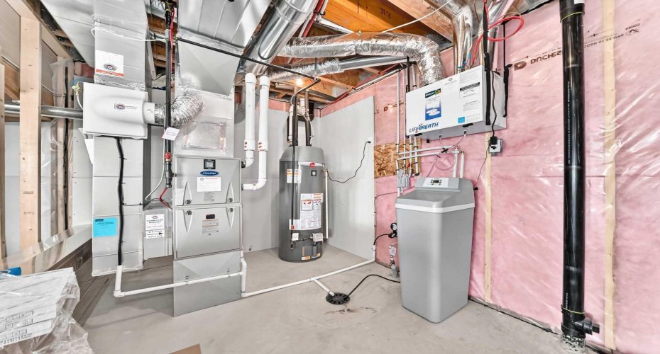 Utility area with water softener.