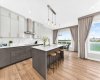 Cupboards to the ceiling, Quartz counters.  Virtually staged