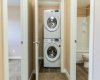 Stacked laundry in closet