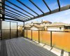 Covered back deck with remote controlled blinds on either end