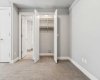 Den/guest bedroom has closet and access to ensuite bathroom.