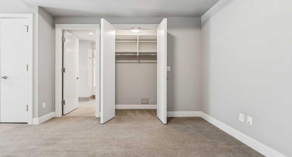 Den/guest bedroom has closet and access to ensuite bathroom.
