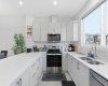 C Shaped spacious kitchen with stainless steel appliances