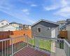 Deck with railings and landscaped yard