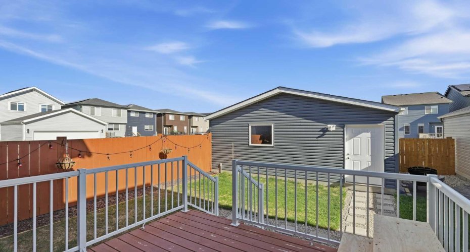 Deck with railings and landscaped yard