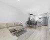 Living room, flows into a spacious dining area and to the kitchen