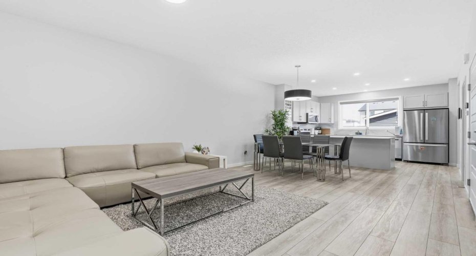Living room, flows into a spacious dining area and to the kitchen