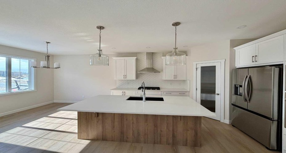 Photos are of property address Versant Rise SW, same Montay II floor plan as 695 Buffaloberry Manor. Photos are representative for layout only, colours and finishes may vary.