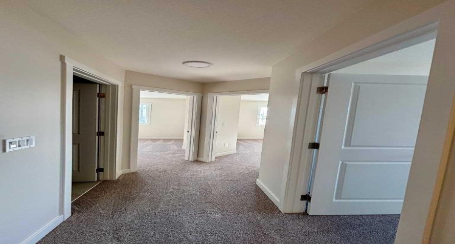 Photos are of property address Versant Rise SW, same Montay II floor plan as 695 Buffaloberry Manor. Photos are representative for layout only, colours and finishes may vary.