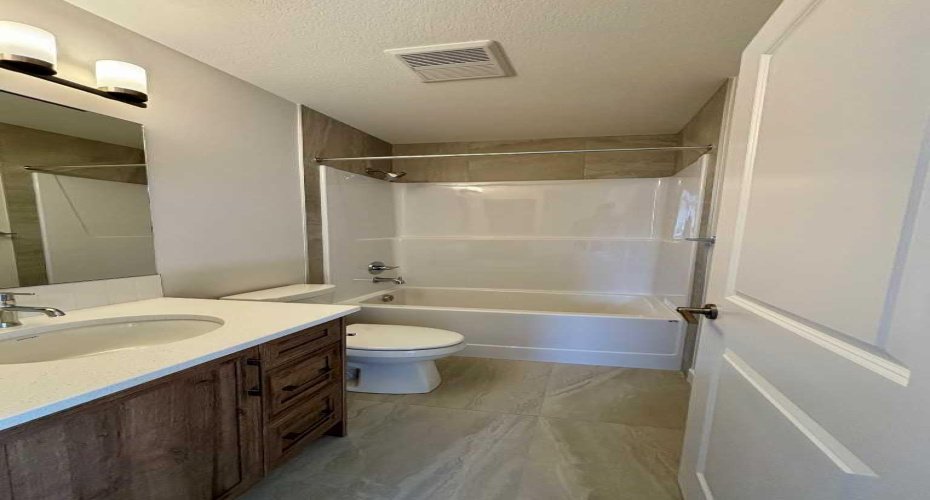 Photos are of property address Versant Rise SW, same Montay II floor plan as 695 Buffaloberry Manor. Photos are representative for layout only, colours and finishes may vary.