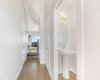 Half bath tucked away by entrance