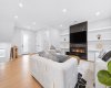 Elegant fireplace creates a warm focal point within the heart of the home.