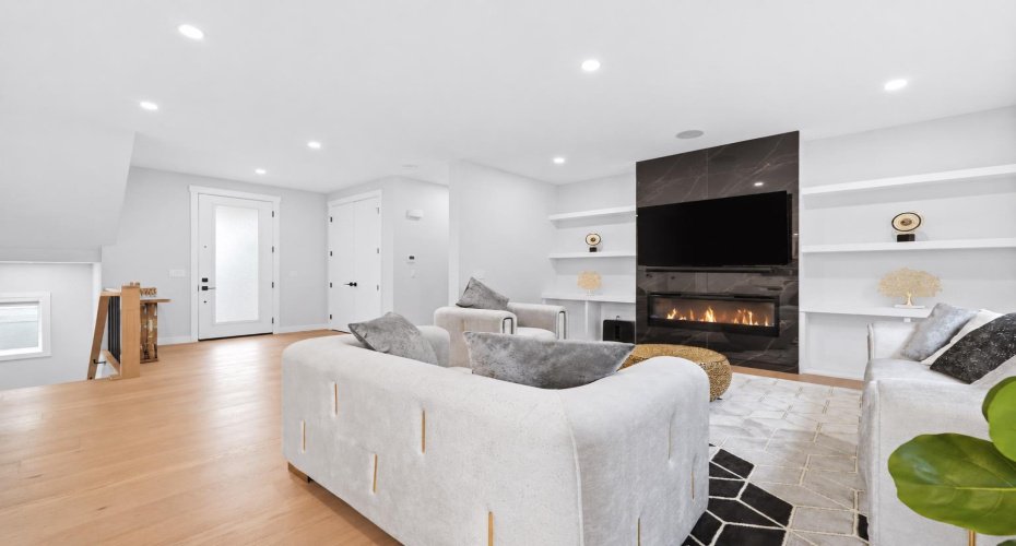 Elegant fireplace creates a warm focal point within the heart of the home.