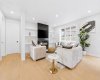 Large windows and clean architectural lines create a bright and inviting atmosphere.