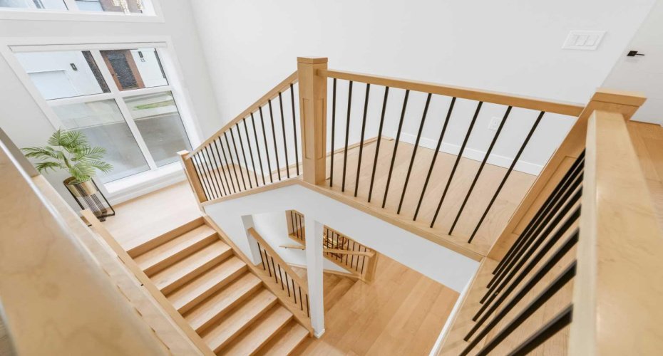 Architectural staircase showcases the home's modern design and attention to detail.
