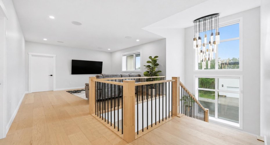 Open upper landing enhances the home's spacious feel and natural flow.