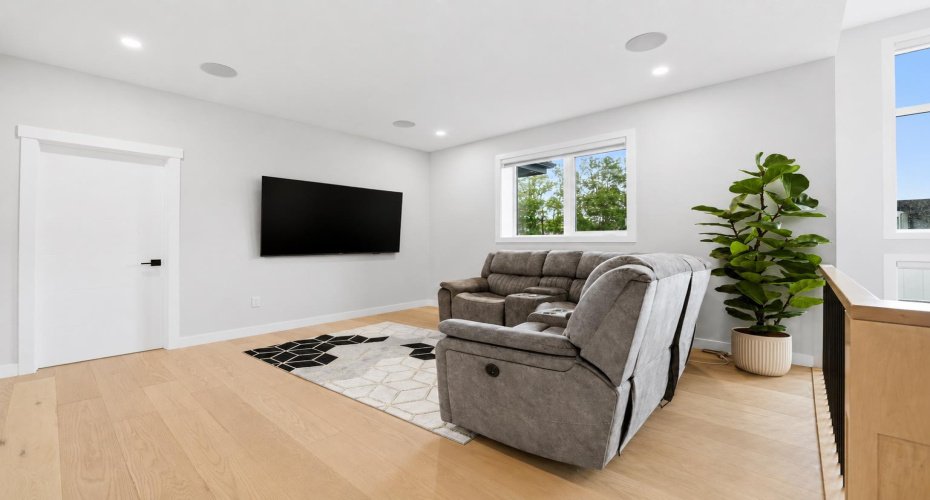 Inviting bonus room creates the perfect retreat for relaxation, entertainment, or family time.