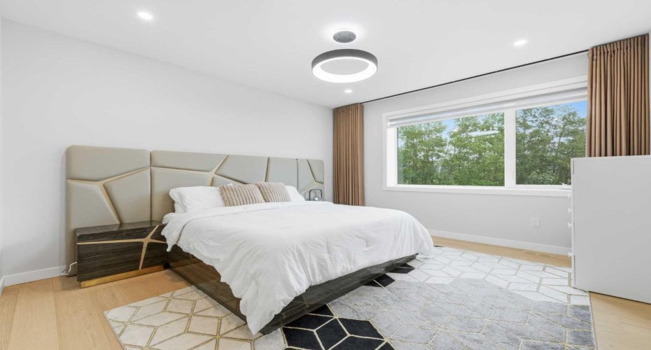 Spacious primary suite offers a peaceful retreat designed for comfort and privacy.