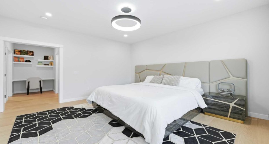 Alt - Primary - Generous proportions allow for a luxurious bedroom arrangement and seating area.