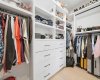 Custom walk-in closet provides exceptional organization and MDF storage solutions.